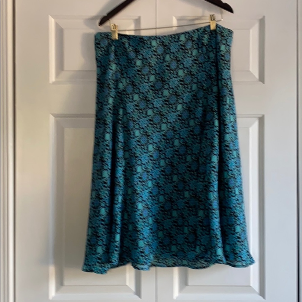 Sheer black and turquoise skirt w/ a black lining